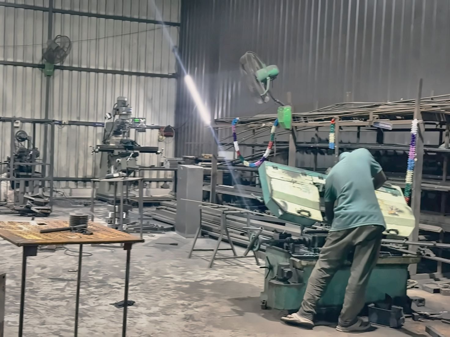 Machinist at work beside the milling machine in the Dream Three workshop