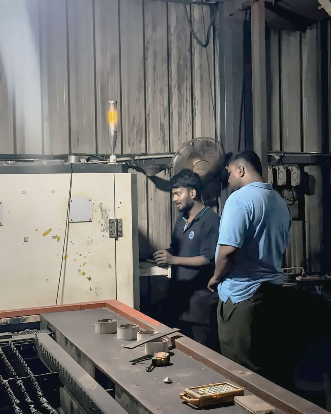 Dream Three team at the laser cutting machine